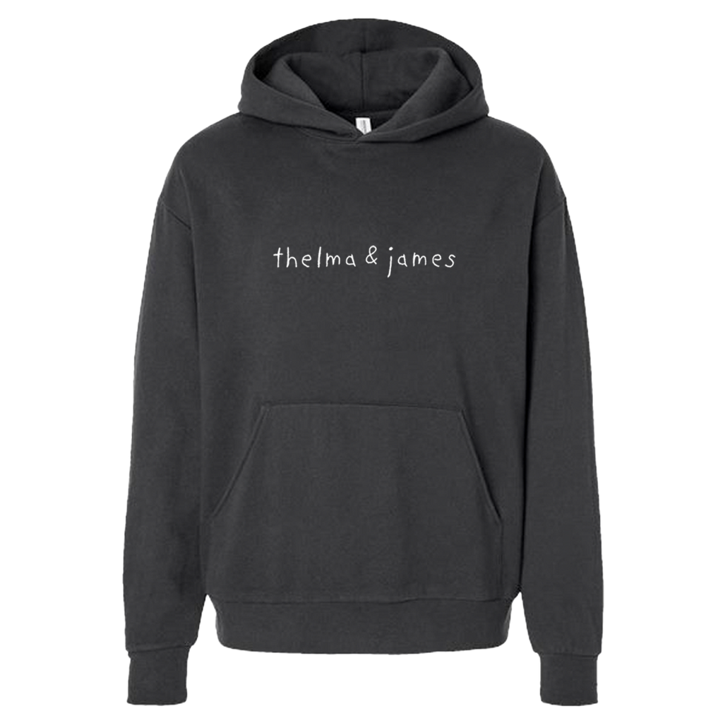 Black hoodie with 'thelma & james' text 